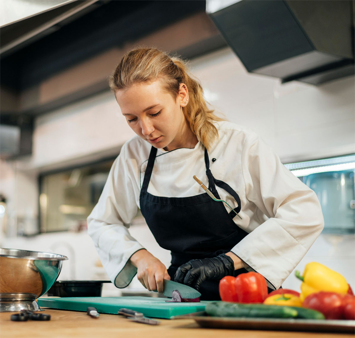 female-chef-chopping-vegetables-kitchen3